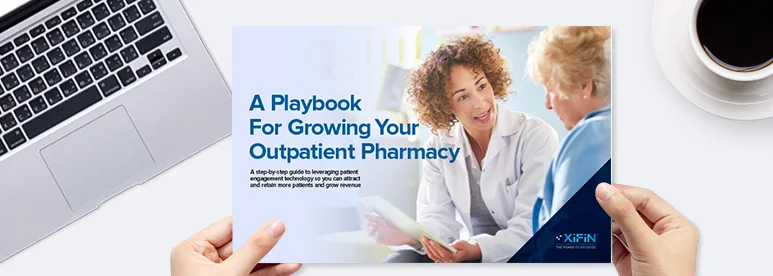 Visual of the White Paper held above a desk and titled, A Playbook for Growing Your Outpatient Pharmacy.
