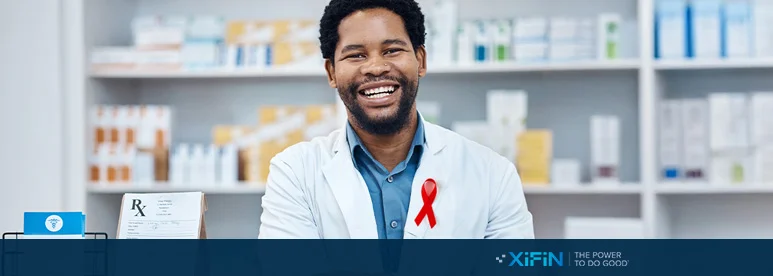Photo of pharmacists with red HIV ribbon